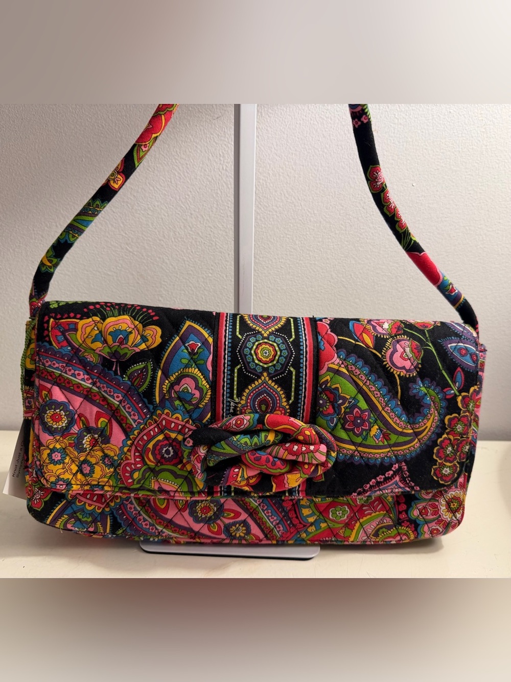 Vera Bradley “Knot Just a Clutch “ in the “Symphony in Hue” pattern.